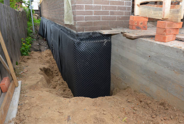 Happy homeowners after waterproofing job in Daviston